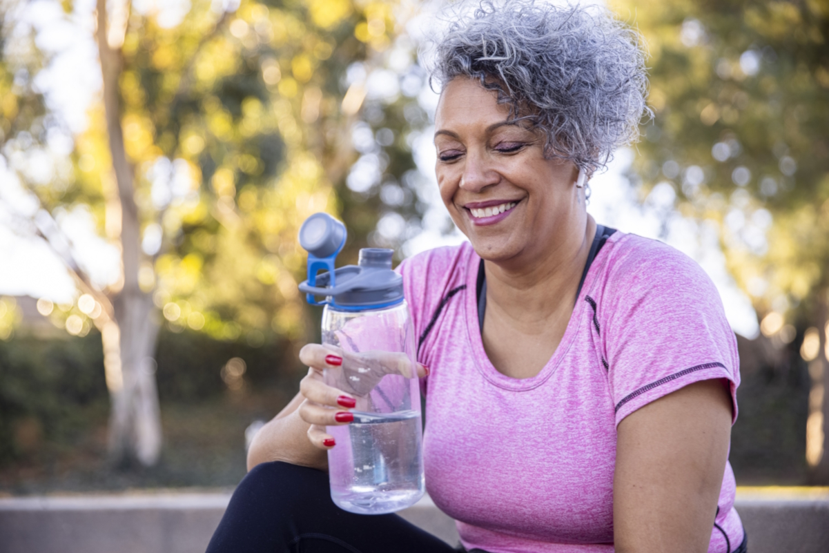 heat safety seniors woman hydrating water