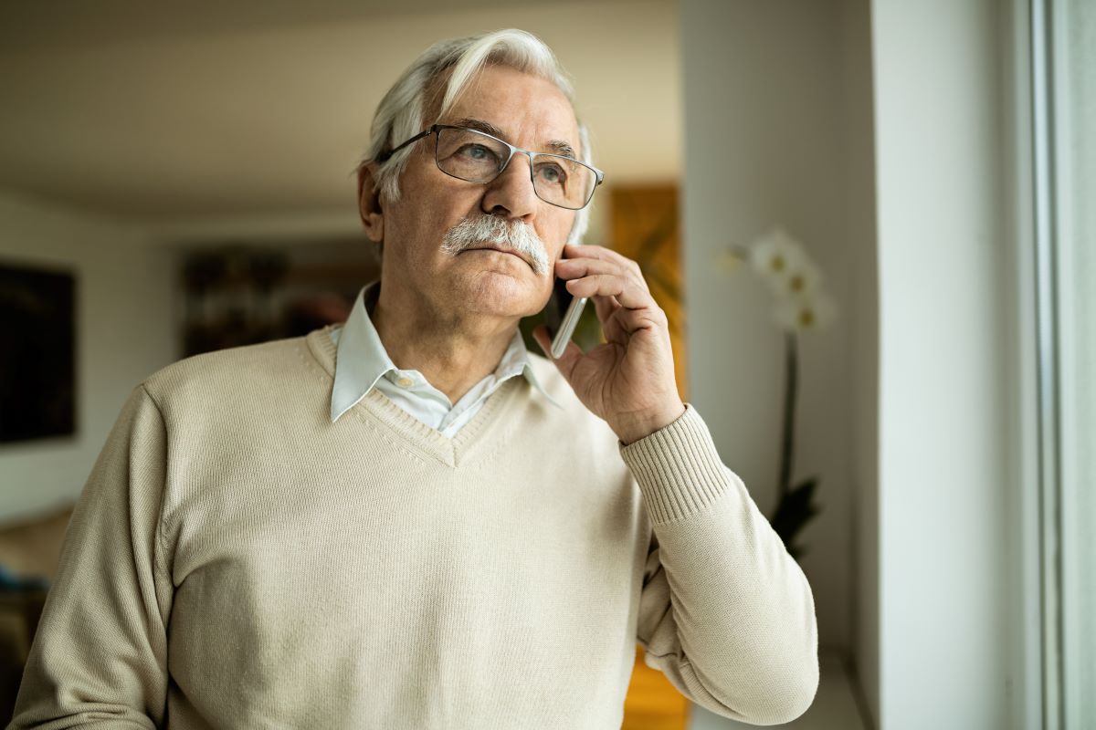 elder fraud senior on phone